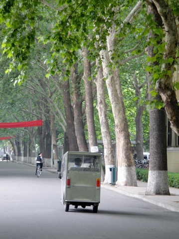BLCU's main thoroughfare. 3-wheel vehicles are very common